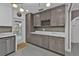 Gray cabinets and white countertops in this well-equipped kitchen at 509 W Olympia Ave, Punta Gorda, FL 33950