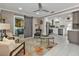 Open living space with barn door, modern furniture, and a view into the kitchen at 509 W Olympia Ave, Punta Gorda, FL 33950