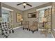 Cozy sitting area with two armchairs and a large TV at 509 W Olympia Ave, Punta Gorda, FL 33950