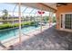 Screened-in pool with canal views at 114 Graham Sw St, Port Charlotte, FL 33952