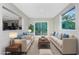 Living room with neutral paint, outside views, and access to backyard deck at 1190 Victoria Ave Nw, Port Charlotte, FL 33948