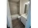 Tiled bathroom with a shower-tub combination, modern fixtures, and a stylish vanity at 12051 Crossgate Ave, Port Charlotte, FL 33981