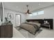 Spacious bedroom with plush carpeting, stylish headboard, and contemporary decor at 12051 Crossgate Ave, Port Charlotte, FL 33981