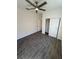 Cozy bedroom with a ceiling fan, neutral walls, and tile flooring, perfect for relaxation at 12051 Crossgate Ave, Port Charlotte, FL 33981