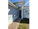 Inviting entryway featuring brickwork, clean lines, and a modern aesthetic at 12051 Crossgate Ave, Port Charlotte, FL 33981