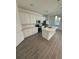 Modern kitchen featuring white cabinets, stainless steel appliances, and a functional island at 12051 Crossgate Ave, Port Charlotte, FL 33981