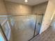 Spacious walk-in shower with tile surround and glass enclosure for a luxurious bathing experience at 12051 Crossgate Ave, Port Charlotte, FL 33981