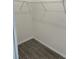 Walk-in closet with tile floors and wire shelving at 12051 Crossgate Ave, Port Charlotte, FL 33981