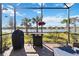 Outdoor patio with grill and scenic lake view at 12750 Oriago St, Venice, FL 34293