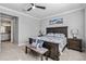 King-size bed, ensuite bathroom access, and large windows at 12750 Oriago St, Venice, FL 34293