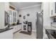 Modern kitchen with stainless steel appliances and granite countertops at 12750 Oriago St, Venice, FL 34293