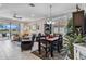 Spacious living room with a view, featuring a comfy sectional sofa and tile floors at 12750 Oriago St, Venice, FL 34293