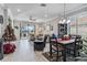 Bright living room with a Christmas tree, sectional sofa, and view at 12750 Oriago St, Venice, FL 34293