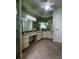 Green bathroom featuring a lengthy vanity, mirrored wall, ceiling fan, and tile flooring at 1438 Razorbill Ln, Punta Gorda, FL 33983