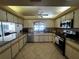 Well-lit kitchen featuring stainless steel appliances, granite countertops, and ample cabinet space at 1438 Razorbill Ln, Punta Gorda, FL 33983