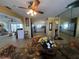 Combined kitchen and living area featuring modern appliances, tile flooring, and an eat-in kitchen area at 1438 Razorbill Ln, Punta Gorda, FL 33983