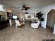 Open-concept living room featuring neutral decor, tile flooring, and a view to the front door at 1438 Razorbill Ln, Punta Gorda, FL 33983