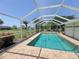 This home has a sparkling pool with a screened-in lanai, perfect for cooling off at 1438 Razorbill Ln, Punta Gorda, FL 33983