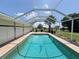 Enjoy the beautiful pool area, perfect for relaxation and entertaining in the screened-in lanai at 1438 Razorbill Ln, Punta Gorda, FL 33983