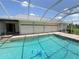 This home has a sparkling pool with a screened-in lanai, perfect for cooling off at 1438 Razorbill Ln, Punta Gorda, FL 33983