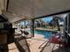 Relax and unwind by the pool in the screened-in lanai with an outdoor bar at 1438 Razorbill Ln, Punta Gorda, FL 33983