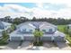 Aerial view of three-unit building and surrounding area at 14672 Sycamore Ct # 3622, Punta Gorda, FL 33955