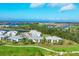 Aerial view of community with golf course and water views at 14672 Sycamore Ct # 3622, Punta Gorda, FL 33955