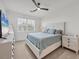 Bedroom with queen-size bed, window, ceiling fan, and dresser at 14672 Sycamore Ct # 3622, Punta Gorda, FL 33955