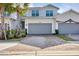 Two-story townhome with gray siding and a paved driveway at 14672 Sycamore Ct # 3622, Punta Gorda, FL 33955