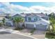 Three-unit building with attached garages, landscaping, and a gray exterior at 14672 Sycamore Ct # 3622, Punta Gorda, FL 33955