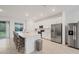 Modern kitchen with stainless steel appliances and island seating at 14672 Sycamore Ct # 3622, Punta Gorda, FL 33955