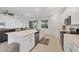 Modern kitchen featuring stainless steel appliances and an expansive island at 14672 Sycamore Ct # 3622, Punta Gorda, FL 33955