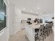 Modern kitchen with white cabinets and large island at 14672 Sycamore Ct # 3622, Punta Gorda, FL 33955
