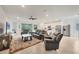 Spacious living room with leather recliners and large TV at 14672 Sycamore Ct # 3622, Punta Gorda, FL 33955