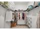 Well-organized walk-in closet with hanging rods and shelves at 14672 Sycamore Ct # 3622, Punta Gorda, FL 33955