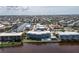 Aerial view of a waterfront condominium complex with a pool and nearby marina at 1600 W Marion Ave # 234, Punta Gorda, FL 33950