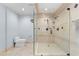 Large tiled shower with multiple shower heads in a light blue bathroom at 1600 W Marion Ave # 234, Punta Gorda, FL 33950