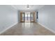 Spacious bedroom with tile flooring and sliding glass doors leading to a waterfront balcony at 1600 W Marion Ave # 234, Punta Gorda, FL 33950