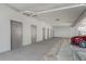 Covered parking area with storage units and a parked car at 1600 W Marion Ave # 234, Punta Gorda, FL 33950