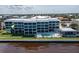Contemporary waterfront condo with glass balconies overlooking pool at 1600 W Marion Ave # 234, Punta Gorda, FL 33950