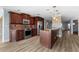 Updated kitchen with dark wood cabinets, stainless steel appliances, and an island at 1600 W Marion Ave # 234, Punta Gorda, FL 33950
