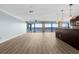 Living room with large windows offering stunning water views at 1600 W Marion Ave # 234, Punta Gorda, FL 33950