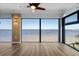 Spacious living room with large windows showcasing breathtaking waterfront views at 1600 W Marion Ave # 234, Punta Gorda, FL 33950