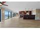Open living and dining space with a kitchen featuring dark wood cabinets at 1600 W Marion Ave # 234, Punta Gorda, FL 33950