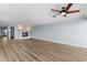Spacious living room with a fireplace and light blue walls at 1600 W Marion Ave # 234, Punta Gorda, FL 33950