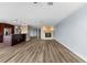 Living room featuring a fireplace, wood floors, and an open layout to the kitchen at 1600 W Marion Ave # 234, Punta Gorda, FL 33950