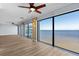Open living room with expansive windows offering panoramic water views at 1600 W Marion Ave # 234, Punta Gorda, FL 33950