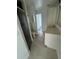 Bathroom featuring tile flooring, shower with glass door, sink with white vanity, and a mirror at 200 Dolphin Pkwy, Punta Gorda, FL 33950