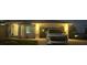 Front of the house with a two-car garage and a car parked in the driveway at night at 200 Dolphin Pkwy, Punta Gorda, FL 33950