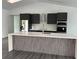 A stunning kitchen island with bar seating, modern appliances, and ample storage at 200 Dolphin Pkwy, Punta Gorda, FL 33950